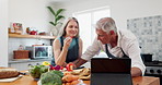 Old couple, cooking and tablet or vegetables in kitchen for online recipe or prepare, nutrition or dinner. Man, woman and internet search in apartment or healthy lunch for retirement, bonding or food