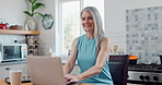 Laptop, face and mature woman in kitchen for research online with freelance creative project. Technology, portrait and senior female freelancer designer typing email on computer at modern apartment.