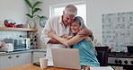 Laptop, happy and couple hugging in kitchen networking on social media, website or the internet. Smile, technology and senior man and woman embracing and browsing on computer in modern apartment.