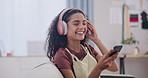 Headphones, music and happy woman with phone in home living room, media or dance to song. Technology, sound and smile of person listening to audio, radio or streaming playlist in lounge on mobile app