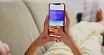 Woman, sofa and smartphone with screen for booking, holiday or vacation on travel website. Female person, living room and technology with scroll for ecommerce, shopping and planning destination