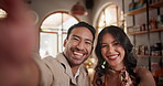 Selfie, dating and couple laughing in restaurant together for love, romance or anniversary celebration. Portrait, smile or photograph with man and woman at romantic dinner for valentines day date