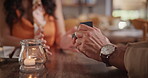 Man, woman and proposal with ring at dinner for love, marriage and engagement on valentines day in restaurant. Closeup of couple, jewellery and hands with box for anniversary, romance and commitment