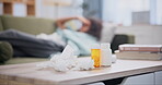 Pills, tissue and woman on sofa with headache for hay fever, allergy or stress at home. Female person, medicine and laying on couch with hand on head for pain, covid 19 or flu virus in living room