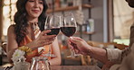 Toast, wine and couple dating in restaurant together for love, romance or anniversary celebration. Smile, cheers or conversation with man and woman drinking at romantic dinner for valentines day date