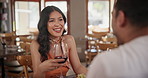 Wine, chatting and couple dating in restaurant together for love, romance or anniversary celebration. Glass, drink or fine dining with man and woman talking at romantic dinner for valentines day date