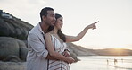 Happy couple, beach and hug with sightseeing on holiday, sunset and together for care bonding in nature. Man, woman and romantic for summer love, commitment and travel adventure by ocean in marriage