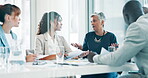 Business people, diversity and meeting for planning, partnership and reviewing ideas for project management in boardroom. Colleagues, corporate and sitting for discussion, collaboration and teamwork