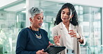 Tablet, talking and walking with business people in lobby of office together for planning or discussion. Technology, feedback or schedule with mentor and woman employee in workplace for research