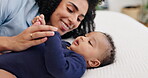 Mother, baby and relax in bedroom with playing for bonding, motherhood and love with happiness. Family, woman and child with smile, care and morning routine in nursery for support, trust and wellness