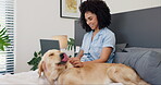 Woman, dog and smile in bedroom with laptop for email, morning routine and social media search in home. Person, animal and pet on bed with playing, distracted and happy for remote work and freelancer