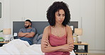 Angry, woman and couple conflict in bedroom with argument, fight and thinking of divorce. Frustrated, man and partner on bed in home with stress, depression and problem in marriage from infertility