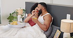 Couple, breakfast in bed and trust with food, happy together with woman feeding man strawberry and orange juice. Love, commitment and nutrition, Valentines day romance and fruit for eating with drink