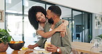 Happy couple, surprise and breakfast at table with hug, talking and bonding together in morning with love. Man, woman and eating healthy food on kitchen counter, embrace and care in marriage in home