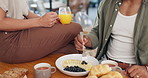 Health, hands and couple eating breakfast with fruit, coffee and juice at table for wellness diet. Food, wellness and closeup of man and woman enjoying brunch meal together in morning at home.