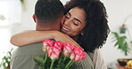 Couple, hug and flowers gift for valentines day with love for surprise bouquet for relationship, anniversary or date. Man, woman and embrace in home with roses for marriage, celebration or present