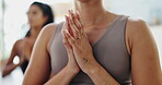 Women, yoga and prayer hands for meditation, holistic wellness and healing, hope or faith in studio. People in zen class with namaste or palm together for peace, calm and mindfulness in a closeup