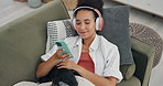 Home, headphones and woman with a cellphone, dog and streaming music in a lounge. Person, apartment and girl with a pet and headset with a smartphone and listening to audio with connection and radio