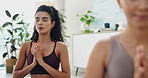 Woman, yoga and praying hands for meditation, holistic exercise and healing or faith in wellness studio. People in zen class breathing, namaste and palm together for peace and to practice mindfulness