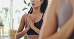 Woman, meditate and praying hands in class for holistic wellness, exercise and healing with breathing exercise. People in closeup with namaste, peace and yoga for mindfulness, mental health and calm