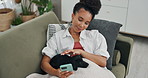Phone, relax and woman on a sofa with dog for bonding, reading or social media scroll at home of day off. Smartphone, search and female person in a living room with puppy, blog or texting in a house