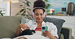 Home, headphones and woman with a smartphone, pet and streaming music in a lounge. Person, apartment and girl with sound and headset with a cellphone and radio with connection and listening to audio