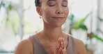 Meditation, woman and namaste in home for health, wellness and care in living room. Calm, relax and breathing of a African female person in a lounge with spiritual practice in a house for zen