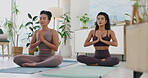 Women, friends and meditation in class for wellness, exercise and healing with harmony and zen in yoga. People or personal trainer on floor with peace, chakra and prayer hands for mental health