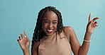 African woman, dancing and face in studio with smile, excited and trendy fashion by blue background. Girl, person and dancer with edgy clothes, moving and happy in portrait with celebration for party