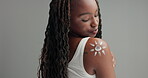 Skin, paint and woman with beauty on body in studio and gray background with cosmetics. African, girl and happy with creative art, symbol or makeup for unique aesthetic and skincare in mockup space