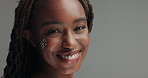 Face, paint and black woman with beauty on skin in studio and gray background with makeup on body. Happy, girl and creative portrait with art in cosmetics for unique aesthetic and skincare mockup