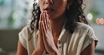 Hands, praying and woman with faith at her home for worship, religion or spiritual wellness. Gratitude, prayer and closeup of female person with christian praise for healing and peace in apartment.