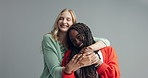 Fashion, friends and face of woman hug in studio with style, confidence and bonding on grey background. Happy, portrait and gen z people embrace with care, support and smile for trendy outfit choice