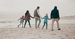 Parents, grandparents and children at beach with back, holding hands or adventure for connection on holiday. People, mother and father with kids, link and bonding for care for walk by sea on vacation