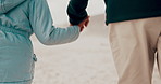 Walking, beach and child holding hands with parents outdoors on holiday, vacation and weekend. Winter, travel and closeup of young girl with family for bonding, adventure and relax together by sea