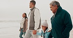 Family, beach and child holding hands with parents outdoors on holiday, vacation and weekend. Winter, travel and  young girl walking with mom, dad and grandpa for bonding, adventure and relax by sea