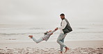 Dad, swing and child at beach for holiday with speed, balance and strong for bonding, care and love. Person, father and kid with game, lift and playful by ocean for vacation with connection in winter