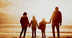 Sunset, seaside and family holding hands, silhouette and vacation with journey and support. Holiday, beach and mother with father and children with parents and travel with care, summer break or ocean