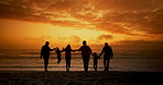 Family, holding hands and swing at beach in sunset, silhouette or play for love, connection and holiday by sea. People, parents and grandparents with children for link, care and bonding by ocean