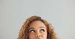 Woman, face and thinking with decision, choice or selection on a gray studio background. Closeup of female person, model or forehead in wonder or thought for choose, option or picking on mockup space