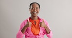 Happy, face and black woman with thumbs up support in studio for feedback, vote or opinion on grey background. Smile, portrait and African female model with hand emoji for winner, voice or opinion