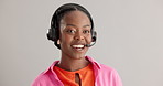 Call center, virtual assistant or black woman in studio consulting for b2b, crm or faq on grey background. Telemarketing, customer service and African lead generation consultant with help or support