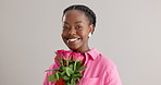 Woman, happy and pink flowers in studio for gift, kindness and gratitude with scent or fragrance on a white background. Face of an African person or model with bouquet of roses for valentines day