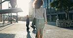 Woman, business and city with morning, commute and sunshine for work. Employee, buildings and street with cbd, office and walking with cape town entrepreneur and urban career or job at startup