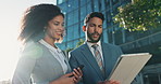 City, businessman and woman with tablet, chat and advice for online review in sunshine. Office building, conversation and business people with digital app, email communication and urban professional.