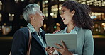 Happy woman, business and night with tablet in city for teamwork, research or outdoor networking. Female person, colleagues or employees laughing and working late with technology in an urban town