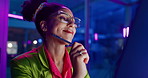 Woman, night and web design on computer, glasses and ideas for app development or coding in office. Female person, thinking and reflection for programming in neon light, project and planning in dark