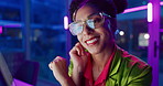 Woman, night and smile in office with neon, tablet and glasses for reading, information technology or coding. Person, girl and developer with click for programming, excited and creative for software