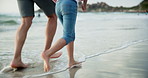 Person, child and legs or running on beach together for holiday adventure, freedom or bonding. Kid, parents and water in summer for ocean relaxing in Florida for trip connection, travel or vacation