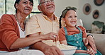 Movie, popcorn and family on sofa in home watching tv, video or streaming funny movies in Mexico. Child, eating and relax with grandparents on couch together on holiday or vacation in retirement